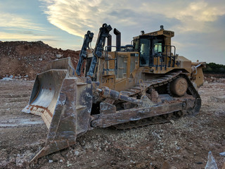 Muddy Caterpillar D11 Bulldozer - Left-Front Quarter View at Sunset © Sean