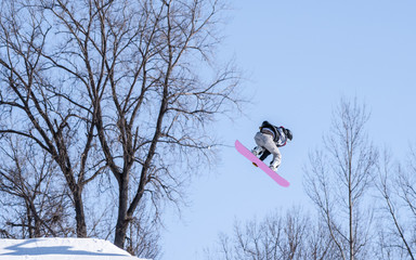 People are enjoying downhill skiing and snowboarding	
