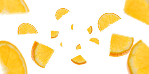 Naklejka premium Orange slice isolated. Citrus fruit tangerine falling in air. Selective focus.