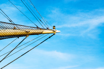 The bow of the ship against the blue sky.