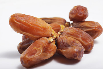 Macro shot of Tunisian dates / Phoenix dactylifera on a white isolated background