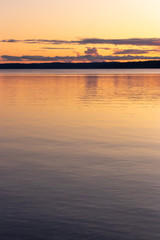 Fototapeta na wymiar calm clean water of the puget sound with colorful sunset