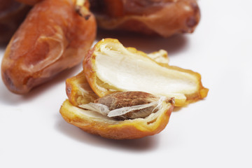 Macro shot of Tunisian dates / Phoenix dactylifera on a white isolated background