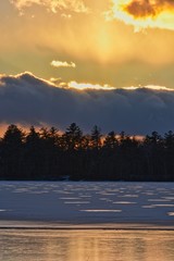 Winter sunset on the frozen lake