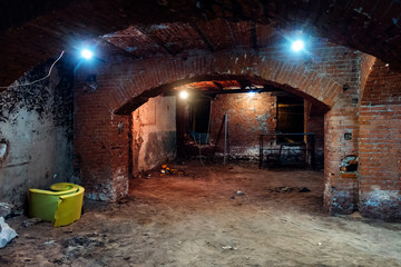 Abandoned empty old dark underground vaulted cellar