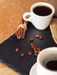 Ground coffee and coffee beans on old cafe table.