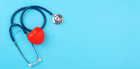 Doctor's Day concept, flat lay top view, stethoscope with red hearts diagnosis of heart disease