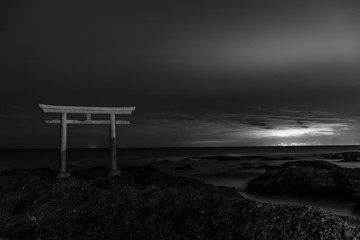 Oowarai japanese shinto torii gate near the sea at night