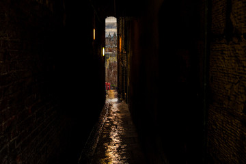 Fototapeta na wymiar Dark Alley with view of Edinburgh Scotland