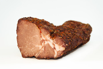 A large piece of juicy smoked meat with spices