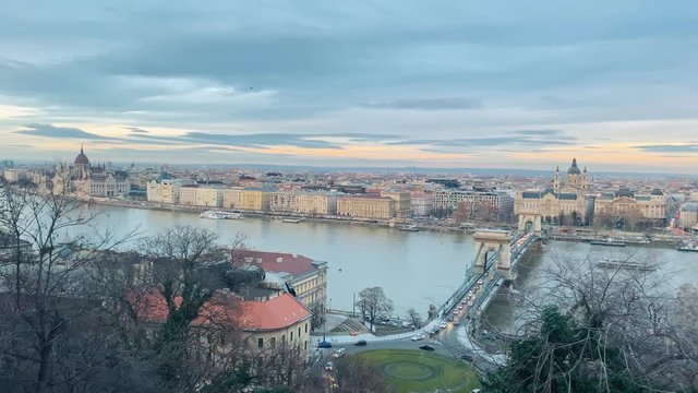 Panning shot of the Danube and the Budapest skyline on a cold winter day.