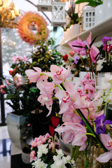Beautiful flowers displayed in a decorated flower shop interior 