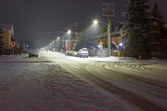 Snowy Street In Downtown Canmore, Alberta, Canada At Night