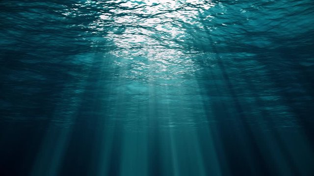 Underwater view with ocean waves flowing in the clear blue water. Beautiful aquatic view with sunbeams shining and creating god rays in the deep sea. 3D animation with swells and tidal waves