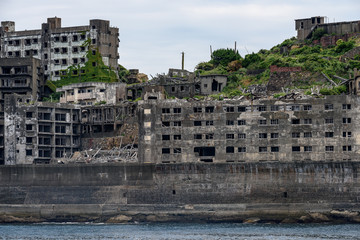 Fototapeta na wymiar Ghost town on an abandoned island called Gunkanjima and also Hashima near Nagasaki