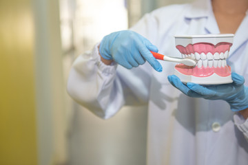 The dentist is examining the patients and advising them at the clinic.