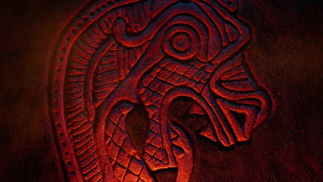 Scary Viking Dragon Creature Rock Carving In Firelight