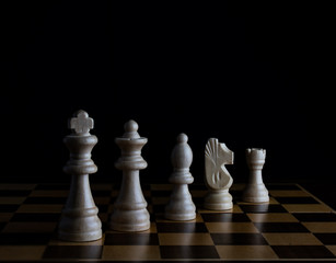 chess pieces on black background