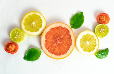 citrus fruits on white background