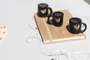 teapots and book on table
