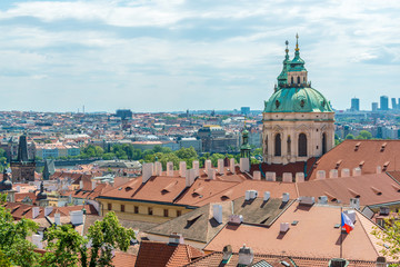 Fototapeta premium Top view to red roofs and blue sky skyline of Prague city Czech republic.