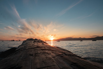 sunset at the sea	and mountains