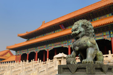 Powerful bronze male lion at the Gate of Supreme Harmony in the Forbidden City Beijing China