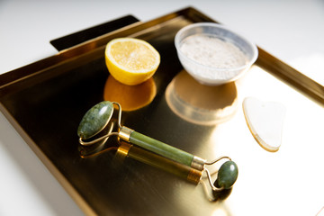 Massage roller and ingredients for mask locating on tray
