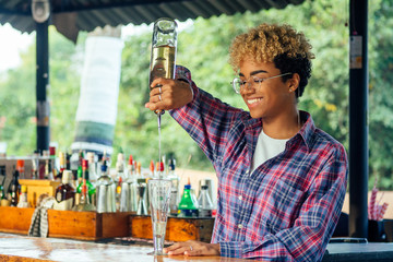 latin hispanic woman barmaid working at tropical hotel or restaurant