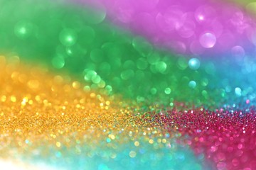 multicolored shining glitter with bokeh. Motley glitter background. Rainbow glitter texture.  macro shimmer texture.Vibrant background with twinkle lights. glitter brilliant mockup
