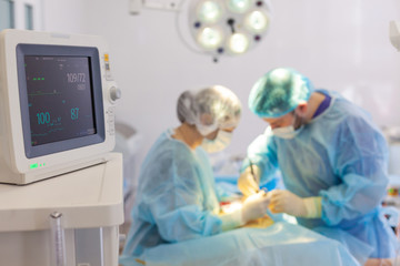 Hospital. Surgeon operates in the operating room. Monitoring of vital signs of the patient in the operating room