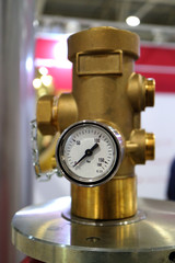 An image of a working pressure gauge with an emergency pressure relief valve of a gas cylinder.
