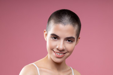 Minimalistic portrait of smiling girl with short hair stock photo