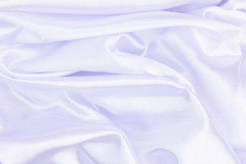 Fototapeta premium White wrinkled fabric with wrinkles and waves, background and Wallpaper of crumpled tissue.
