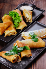 Delicious Tasty Homemade crepes or pancakes with raspberries and blueberries for breakfast