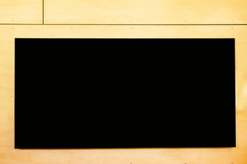 A rectangle blackboard on a wooden background