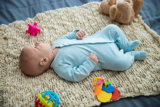 Adorable baby looking around himself stock photo