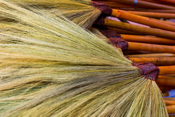 Pile of bamboo brooms
