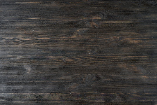 Dark black brown texture wooden background pattern. Texture of natural wood, pine rustic hardwood