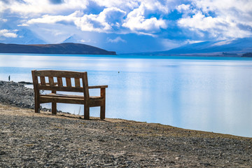 Fototapeta na wymiar wooden chair on the lake