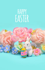 Happy Easter holiday background. Easter bunny toy, egg and flower. spring season. 