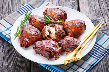 roasted Chicken thighs on a white plate