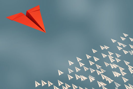 3D illustration of leadership success business concept rocket paper fly over color background lead rocket stand out of other paper rocket follower
