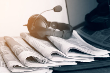 Newspapers on the desktop in the office, media concept