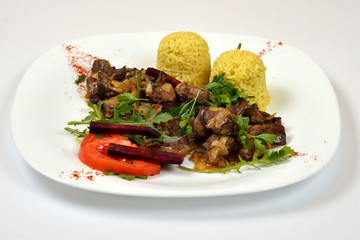 Food from a chicken restaurant with vegetables and sauce.