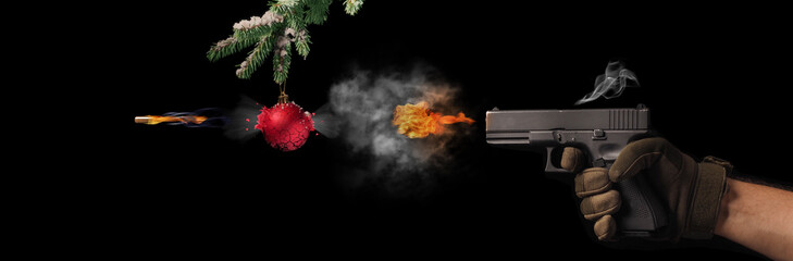 Freezing shot of a gun and Christmas on black background. Concept gun club, gun-shop, shooting range.