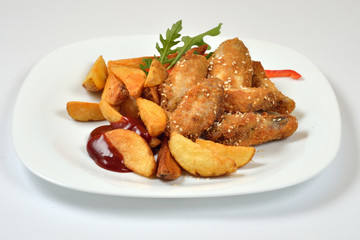 Food from a chicken restaurant with vegetables and sauce.