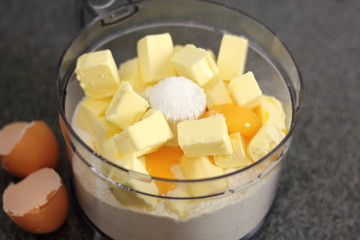 Making dough. Diced butter, eggs and flour in food processor. Making Chocolate, Pear and Pecan Pie Series.