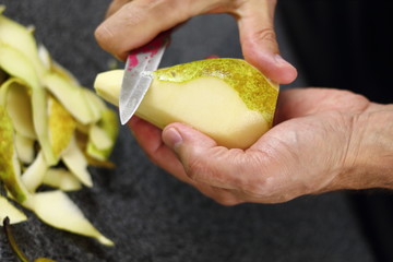 Peeling pears. Making Chocolate, Pear and Pecan Pie Series.