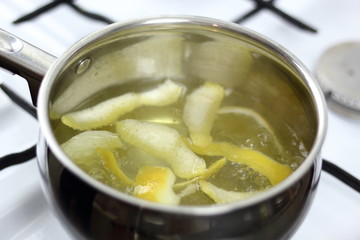 Boiling lemon peels in saucepan. Making Chocolate, Pear and Pecan Pie Series.